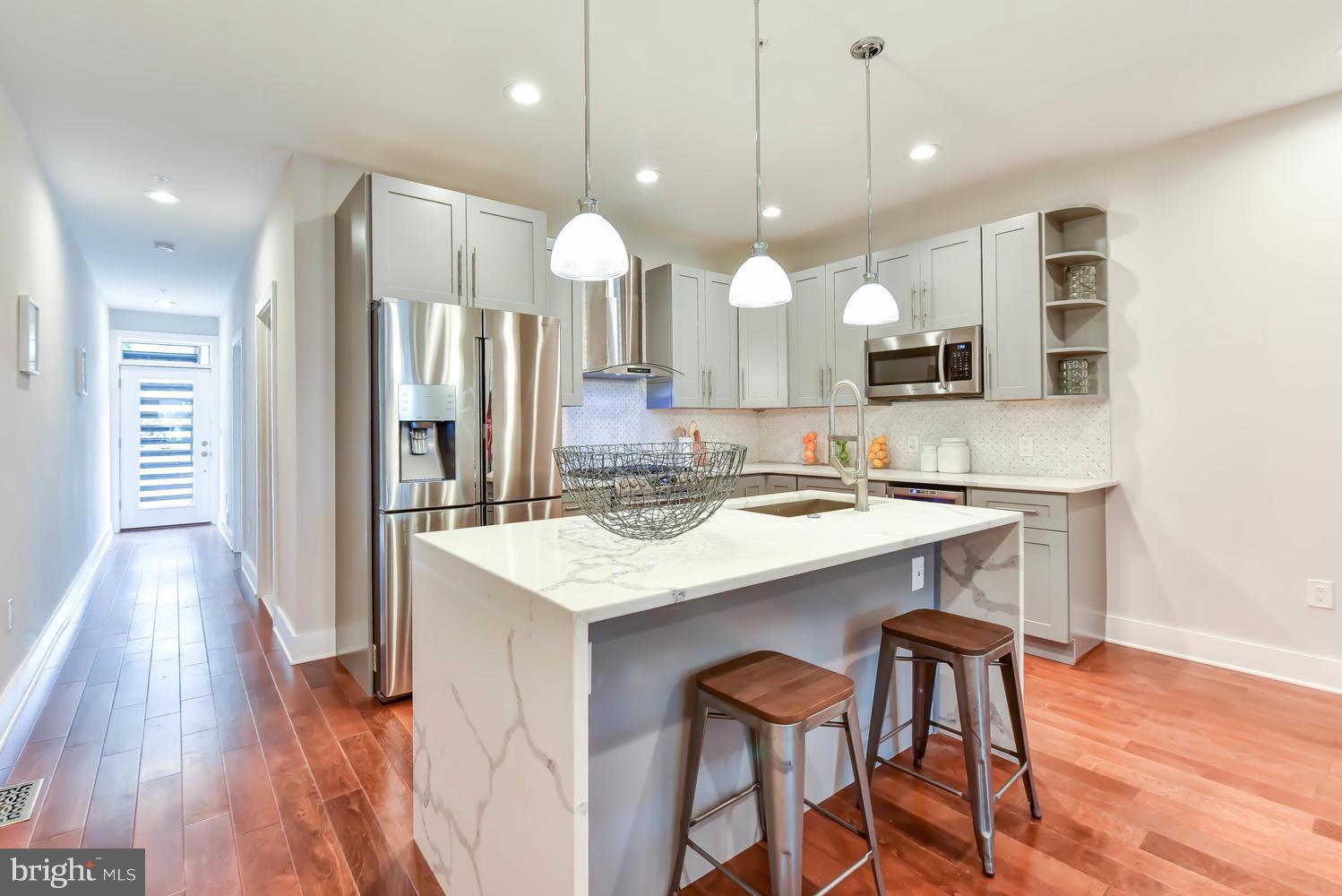 1327 Spring Road Northwest, Unit 1 Washington, DC 20010 - Photo 1 of 22 Gourmet kitchen w/ waterfall island