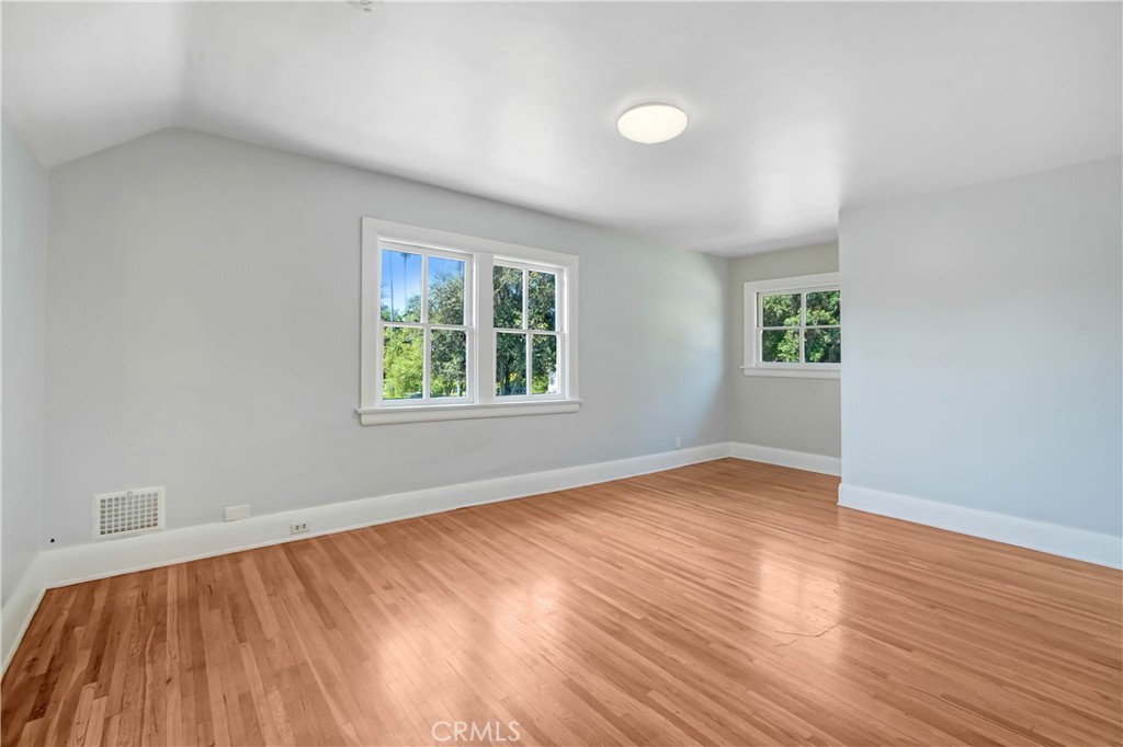 1632 Fletcher Avenue South Pasadena, CA 91030 - Photo 20 of 25 an empty room with wooden floor and windows