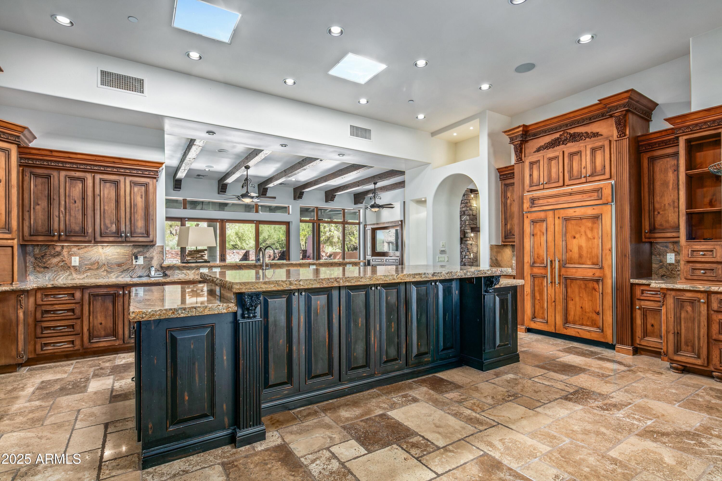 9533 East Rising Sun Drive Scottsdale, AZ 85262 - Photo 13 of 46 a very nice looking kitchen with granite countertop a stove a sink and a refrigerator