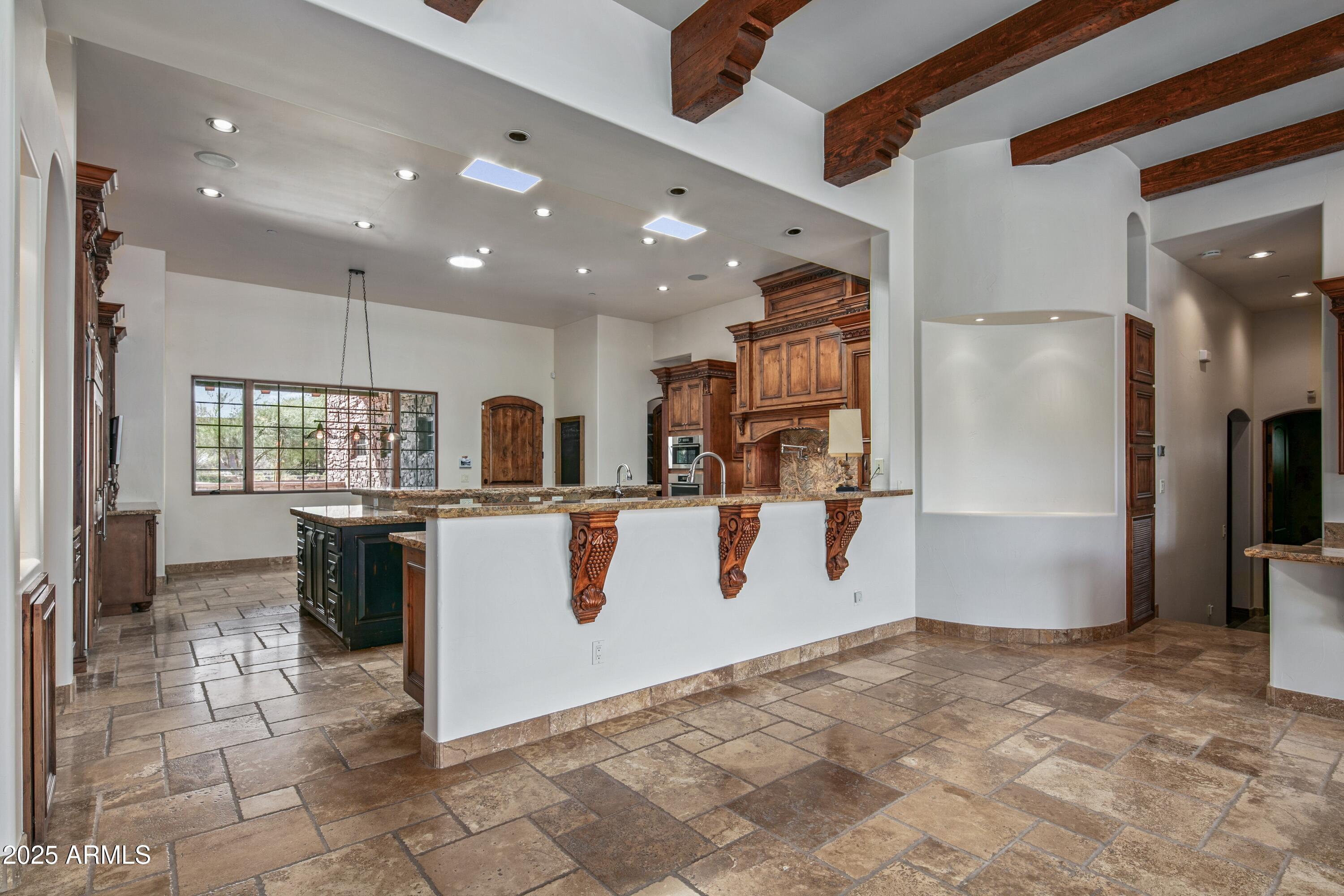9533 East Rising Sun Drive Scottsdale, AZ 85262 - Photo 16 of 46 a view of kitchen with refrigerator microwave and cabinets