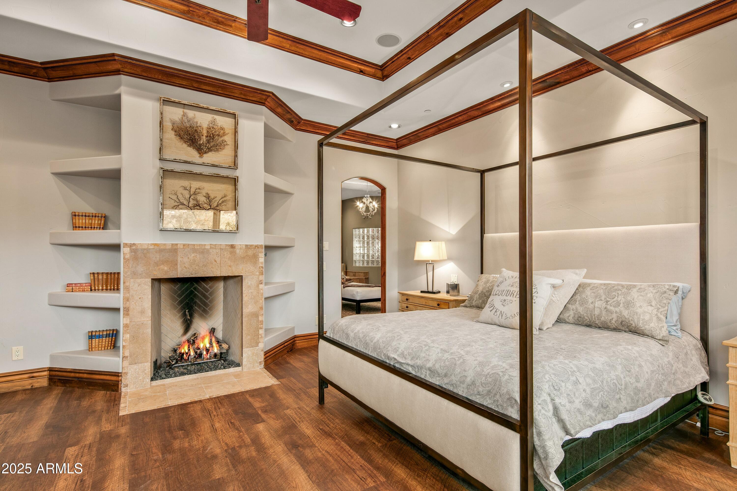 9533 East Rising Sun Drive Scottsdale, AZ 85262 - Photo 19 of 46 a bedroom with a bed and a fireplace