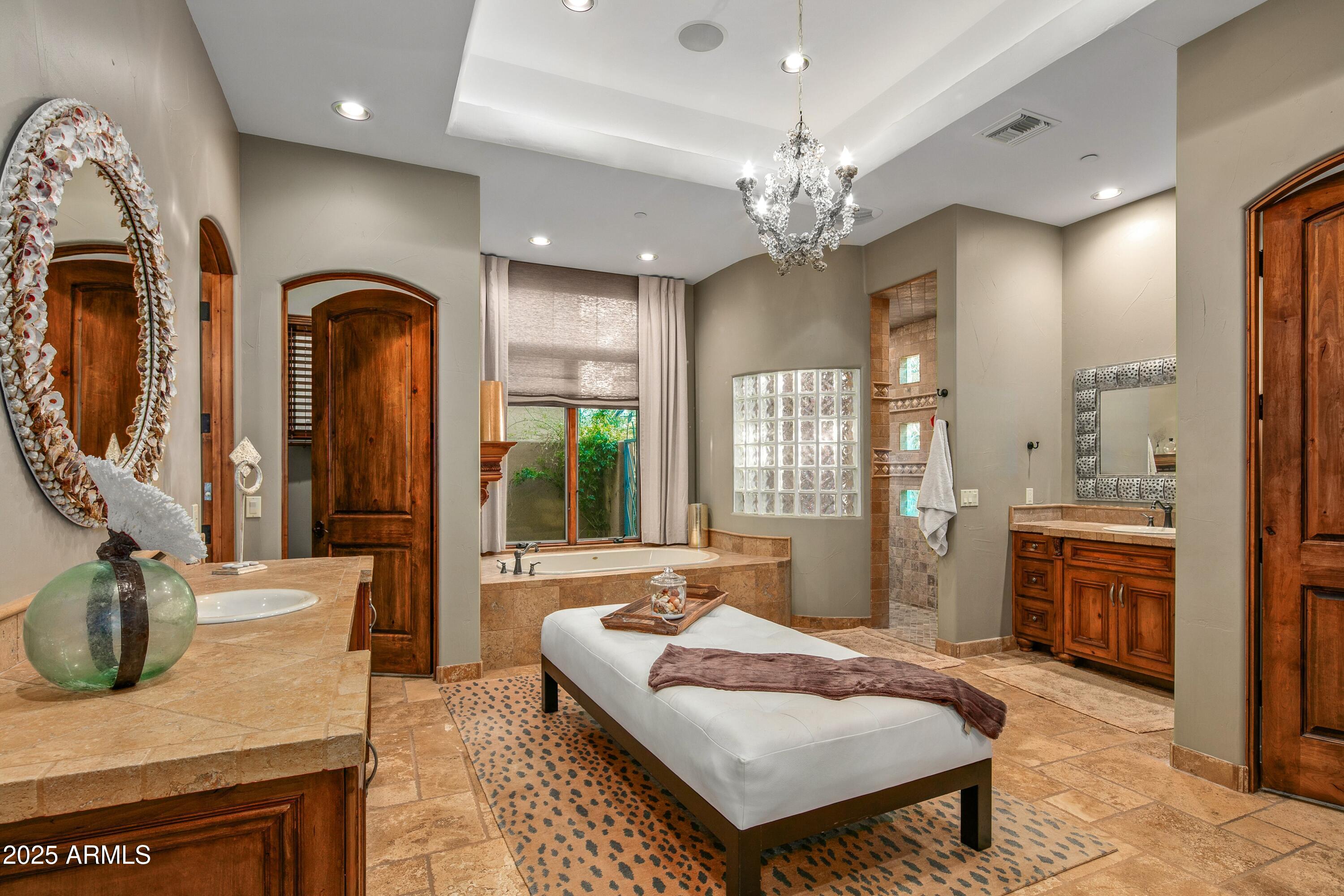 9533 East Rising Sun Drive Scottsdale, AZ 85262 - Photo 21 of 46 a living room with furniture chandelier and a fireplace