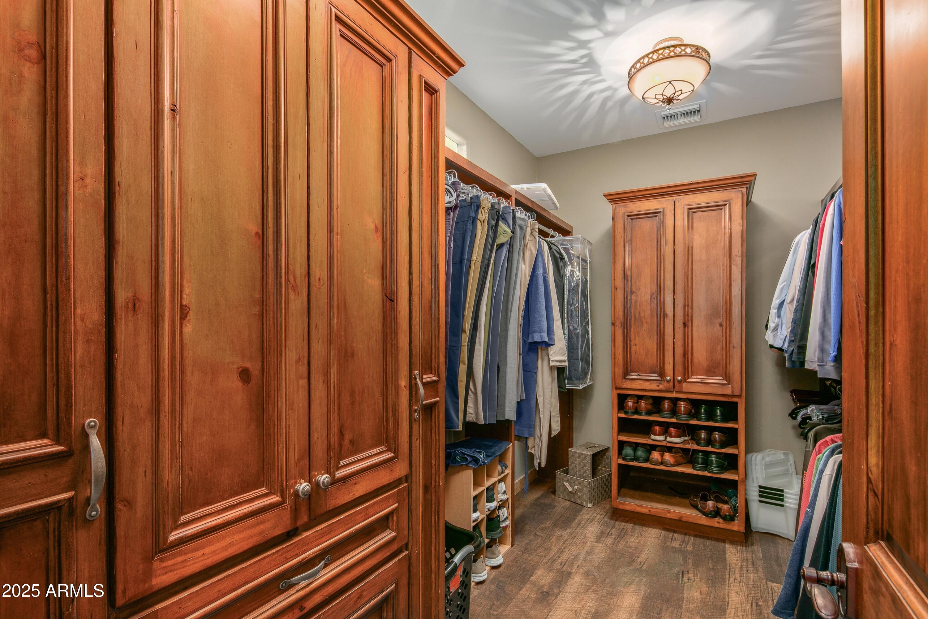 9533 East Rising Sun Drive Scottsdale, AZ 85262 - Photo 24 of 46 a view of walk in closet with clothes
