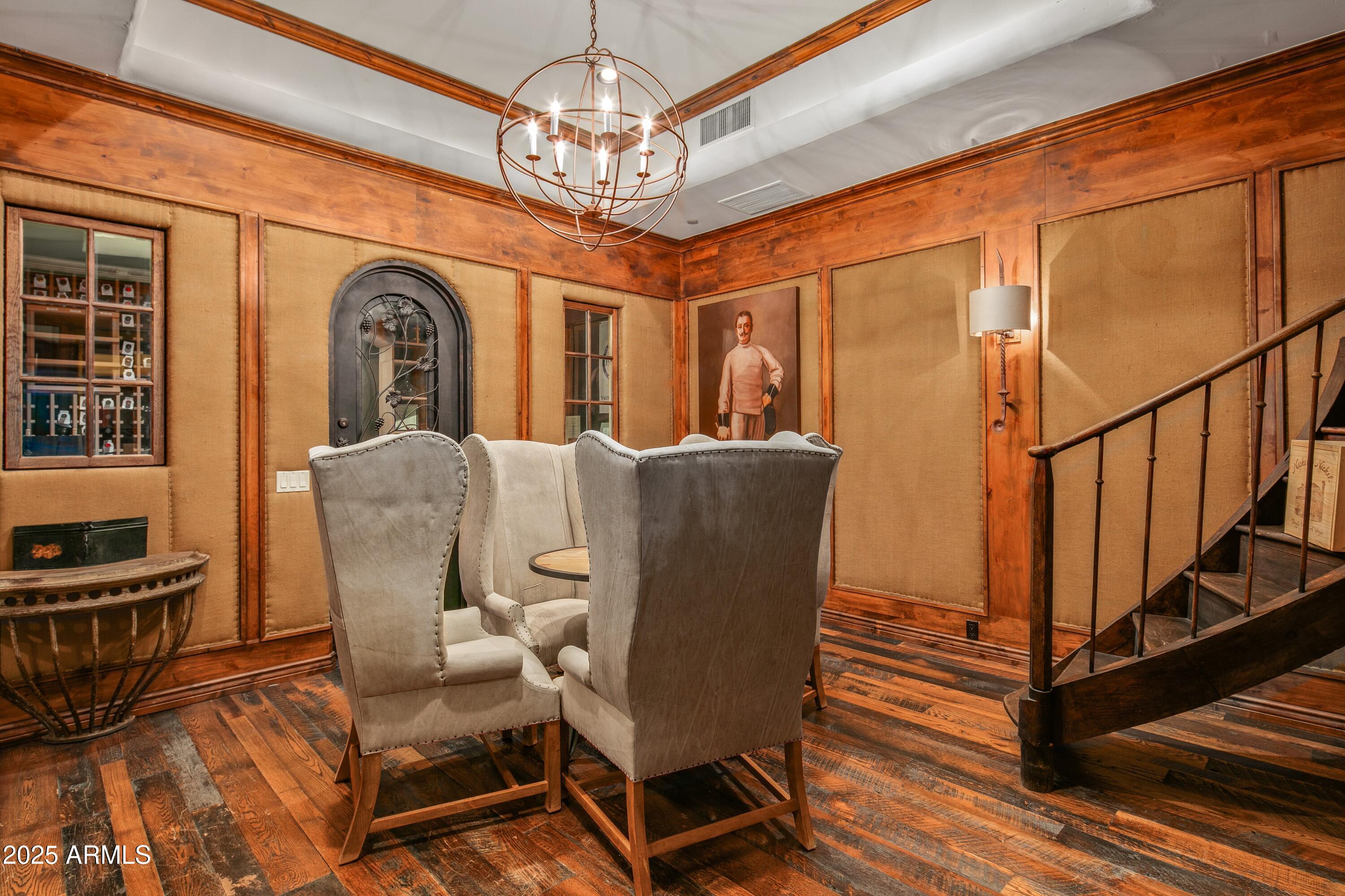 9533 East Rising Sun Drive Scottsdale, AZ 85262 - Photo 27 of 46 a view of a dining room with furniture wooden floor and chandelier
