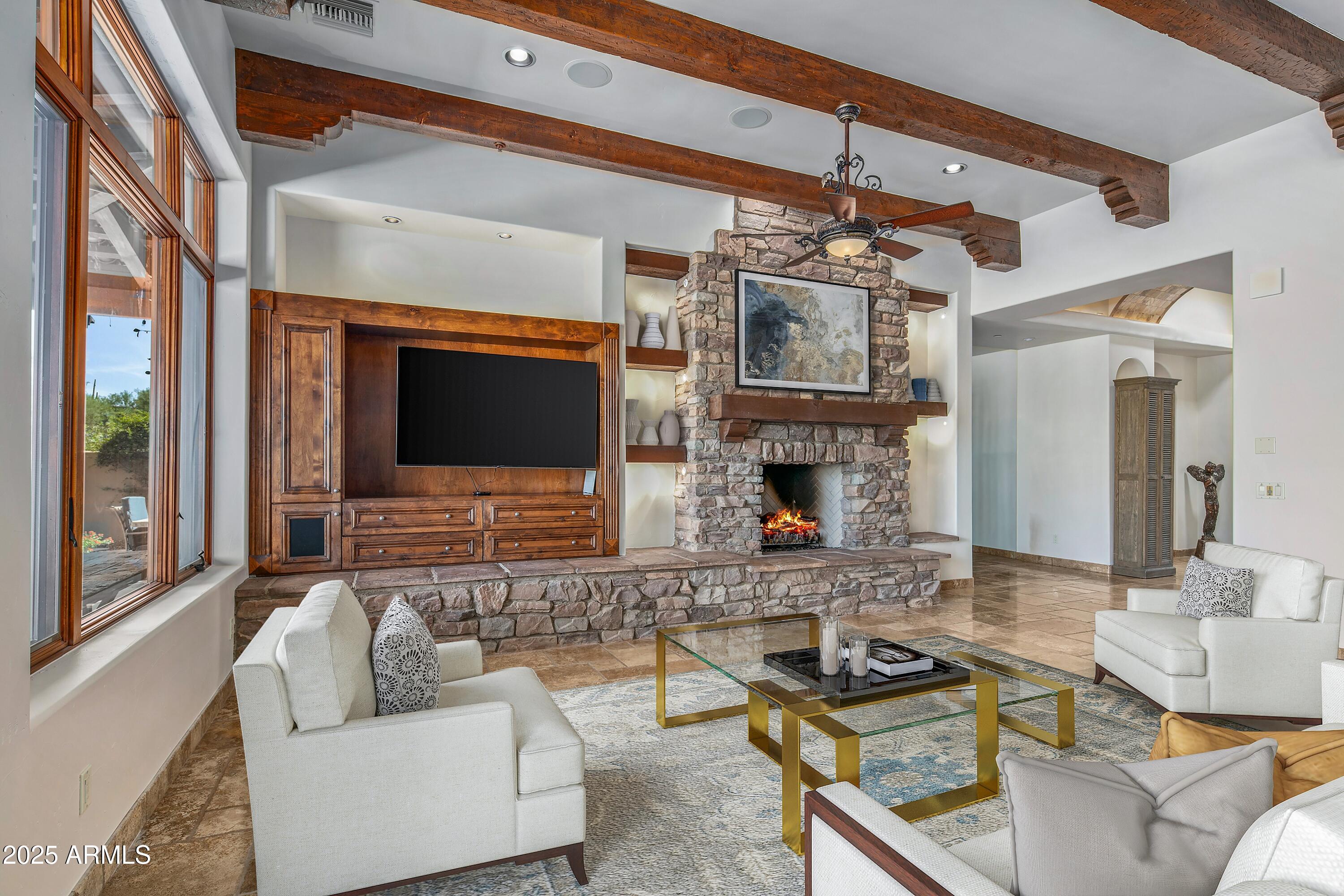 9533 East Rising Sun Drive Scottsdale, AZ 85262 - Photo 30 of 46 a living room with fireplace furniture and a flat screen tv