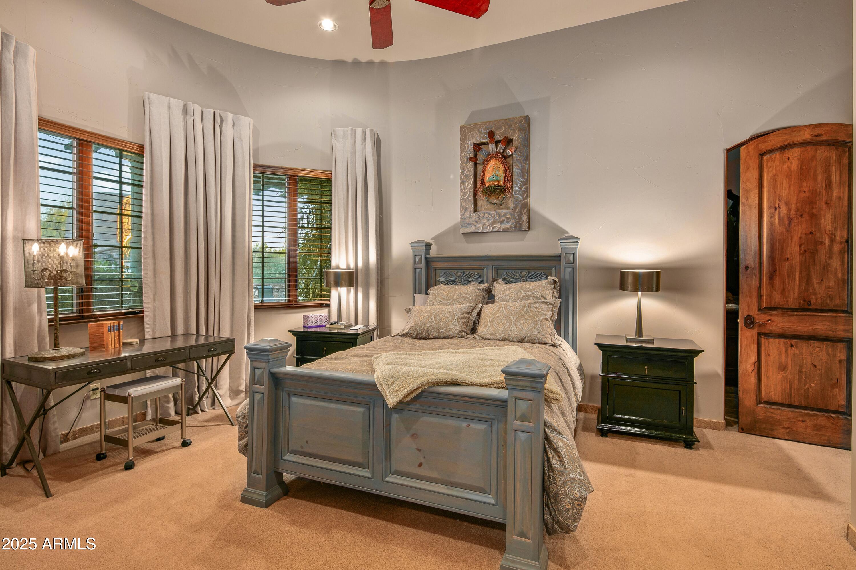 9533 East Rising Sun Drive Scottsdale, AZ 85262 - Photo 31 of 46 a bedroom with a bed and wooden floor