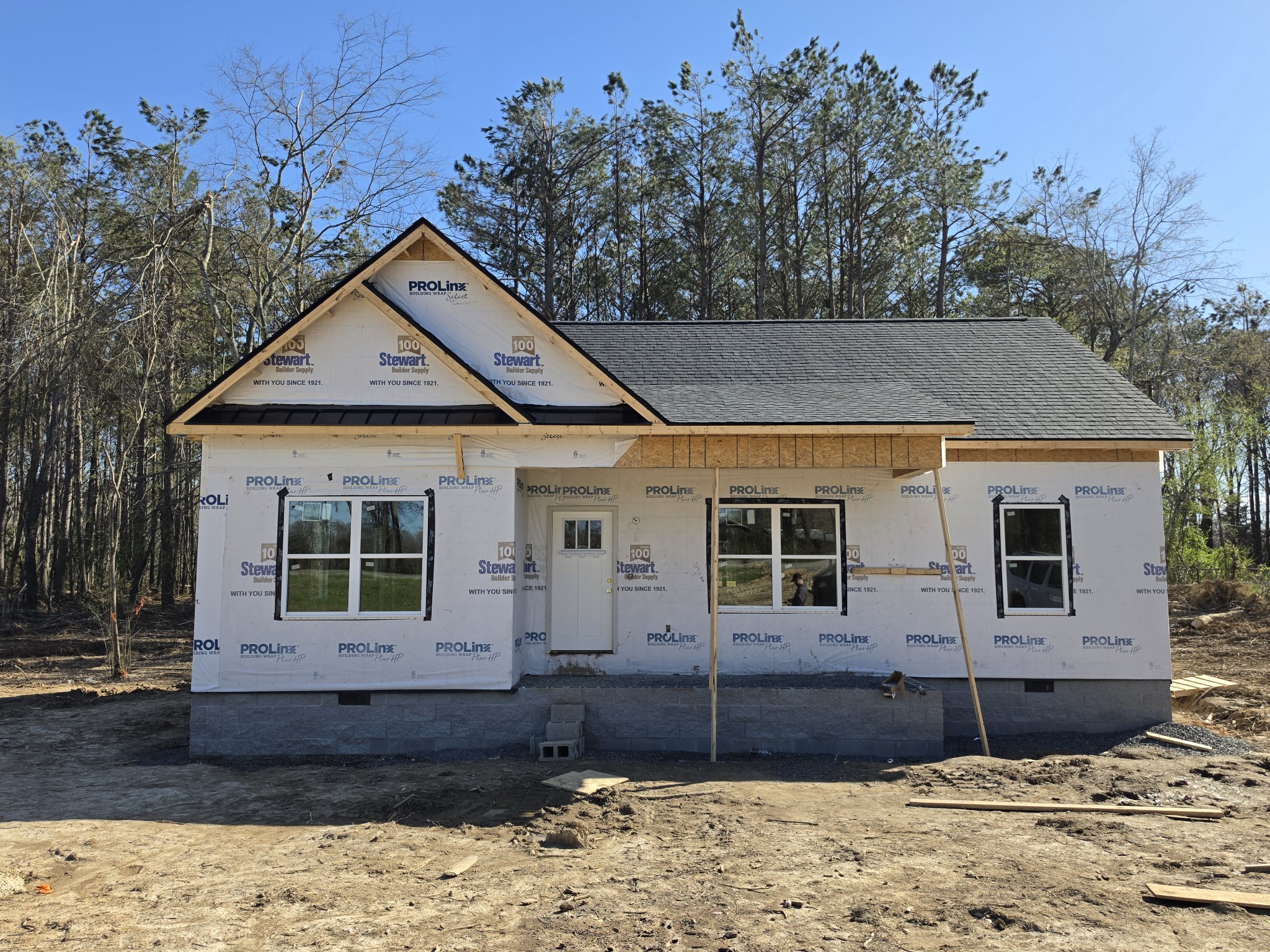 9990 North Tidwell Road Bon Aqua, TN 37025 - Photo 2 of 3 a front view of a house with a yard and garage