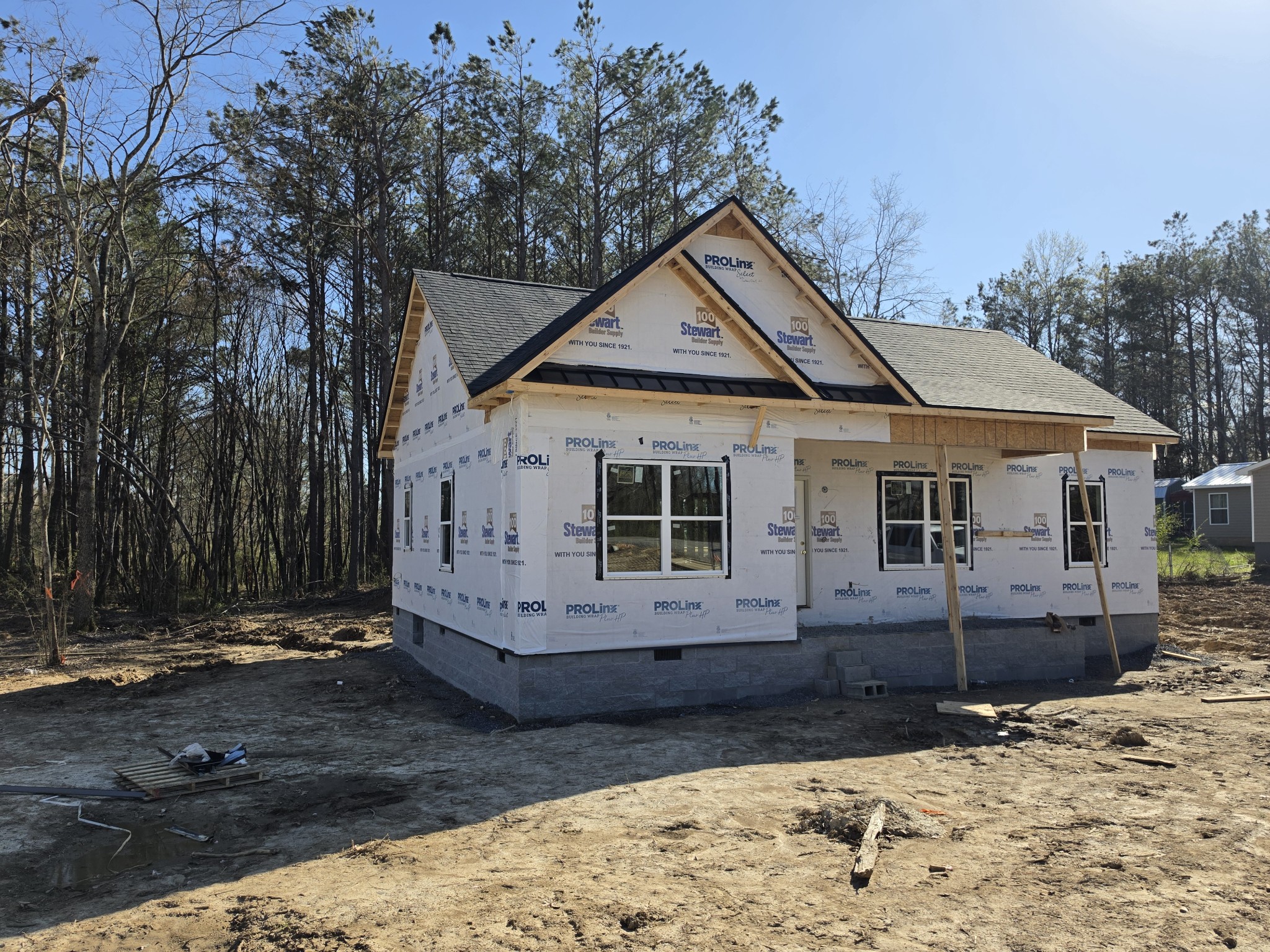 9990 North Tidwell Road Bon Aqua, TN 37025 - Photo 3 of 3 a front view of a house with a yard