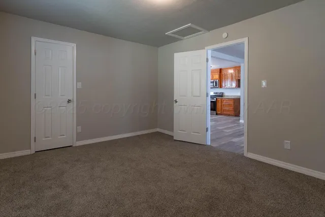 an empty room and fire place