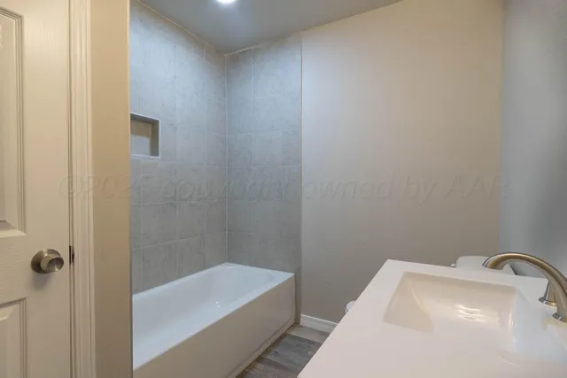 a bathroom with a sink and bathtub