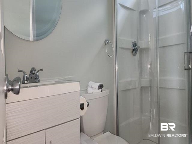 820 Carrozza Lane Foley, AL 36535 - Photo 21 of 45 Bathroom with vanity, toilet, and an enclosed shower
