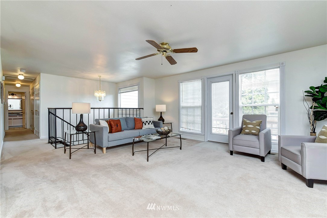 22708 3rd Avenue Southeast Bothell, WA 98021 - Photo 11 of 26 a living room with furniture and a large window
