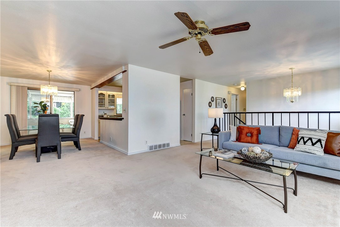 22708 3rd Avenue Southeast Bothell, WA 98021 - Photo 12 of 26 a living room with furniture and a ceiling fan