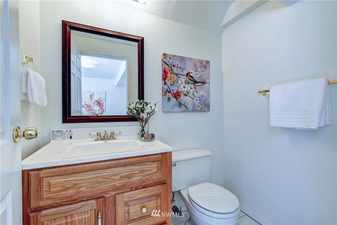 22708 3rd Avenue Southeast Bothell, WA 98021 - Photo 19 of 26 a bathroom with a toilet sink and mirror