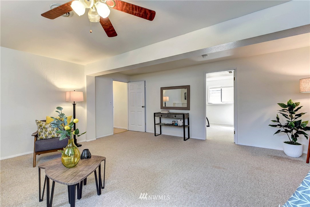 22708 3rd Avenue Southeast Bothell, WA 98021 - Photo 20 of 26 a living room with furniture flowerpot and a window