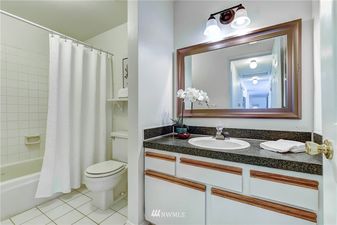 22708 3rd Avenue Southeast Bothell, WA 98021 - Photo 6 of 26 a bathroom with a granite countertop sink toilet and shower