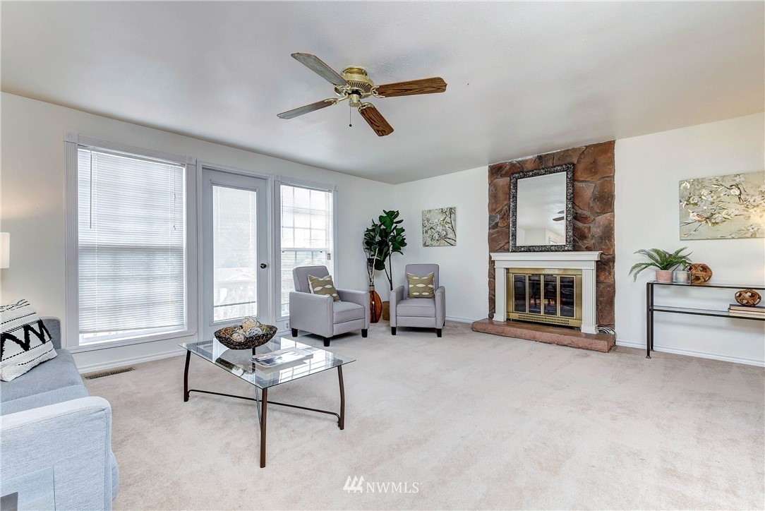 22708 3rd Avenue Southeast Bothell, WA 98021 - Photo 10 of 26 a living room with furniture and a fireplace