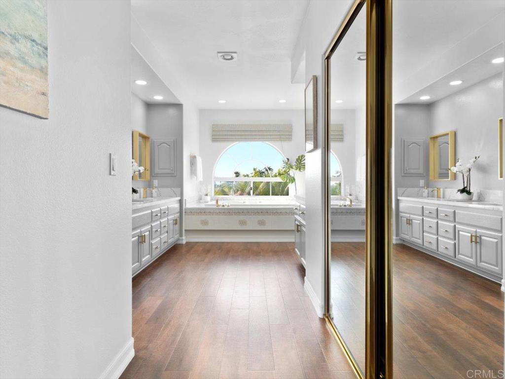 1780 Laurel Road Oceanside, CA 92054 - Photo 16 of 46 a view of hallway with a large window and wooden floor