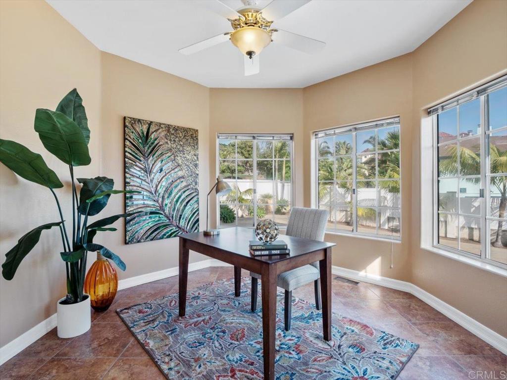 1780 Laurel Road Oceanside, CA 92054 - Photo 27 of 46 a living room with furniture and a potted plant