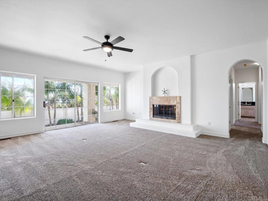 1780 Laurel Road Oceanside, CA 92054 - Photo 28 of 46 a view of an empty room with a fireplace and a window