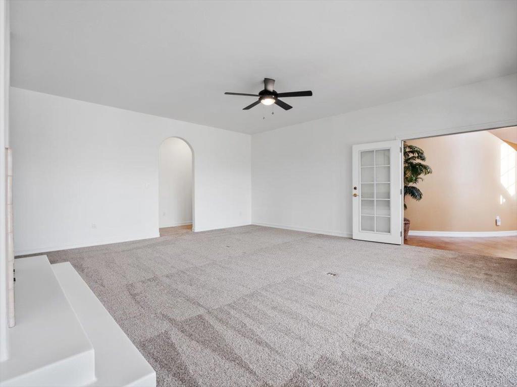 1780 Laurel Road Oceanside, CA 92054 - Photo 30 of 46 an empty room with a ceiling fan and a window