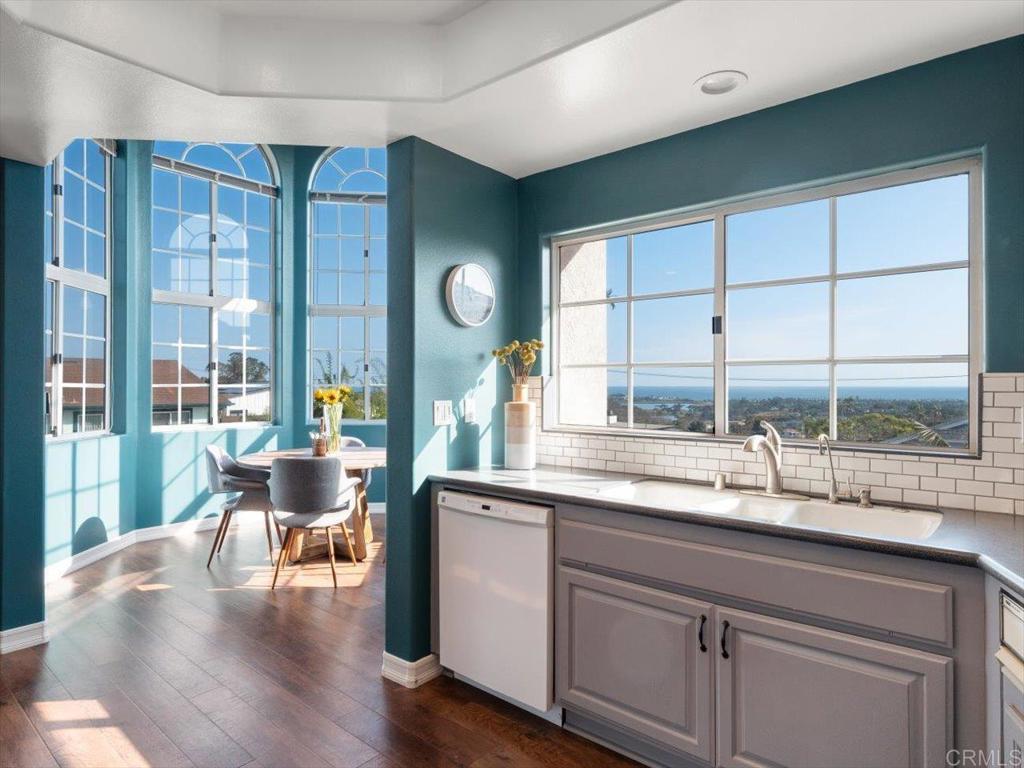 1780 Laurel Road Oceanside, CA 92054 - Photo 9 of 46 a kitchen with a sink and wooden cabinets