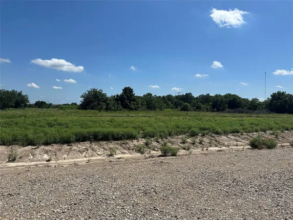 a view of a street with a park