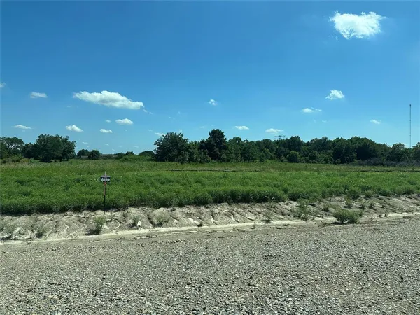 a backyard of a house with lots of green space and deers