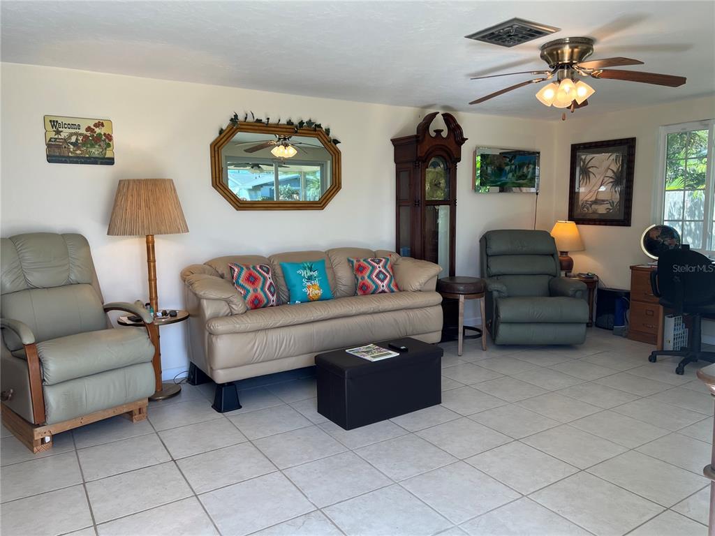1228 Nantucket Road Venice, FL 34293 - Photo 19 of 32 a living room with furniture and a baby crib