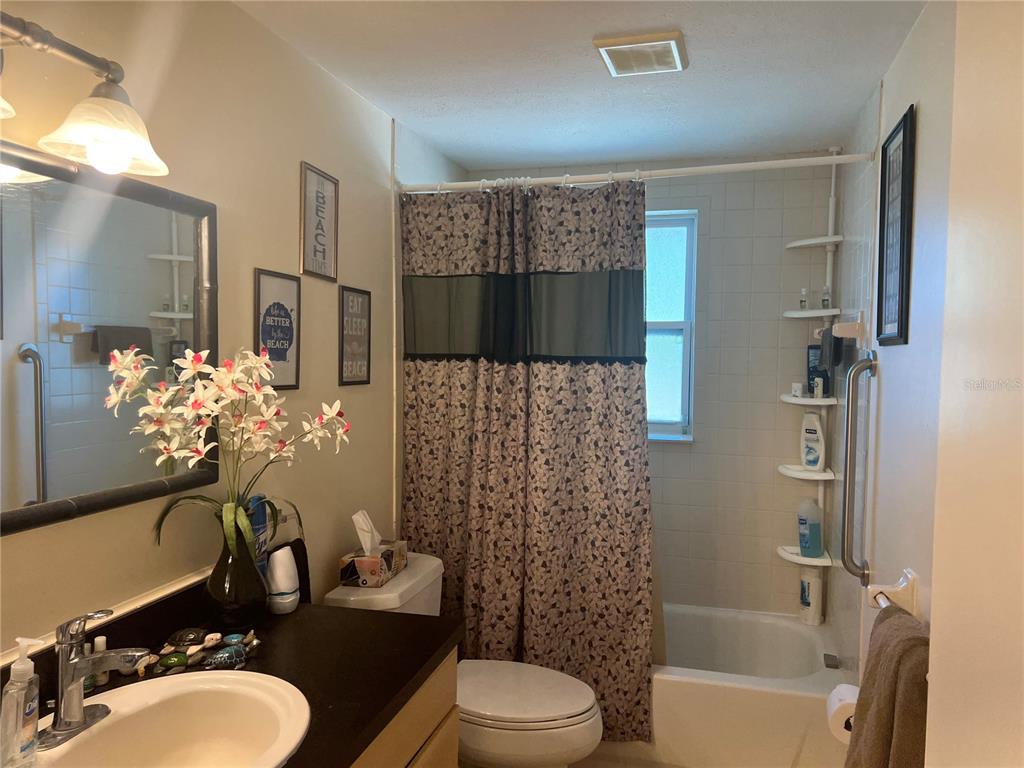 1228 Nantucket Road Venice, FL 34293 - Photo 26 of 32 a bathroom with a sink toilet and shower