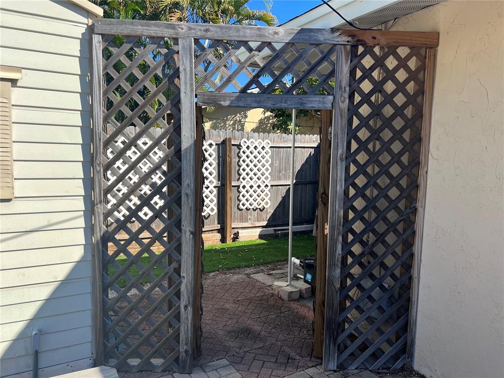 1228 Nantucket Road Venice, FL 34293 - Photo 30 of 32 a backyard of a house with lots of green space