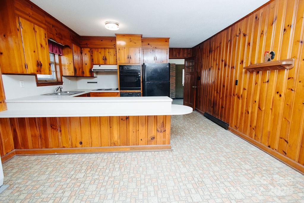 541 Romine Drive Marion, NC 28752 - Photo 5 of 23 a view of kitchen with stainless steel appliances kitchen island wooden cabinets and chair