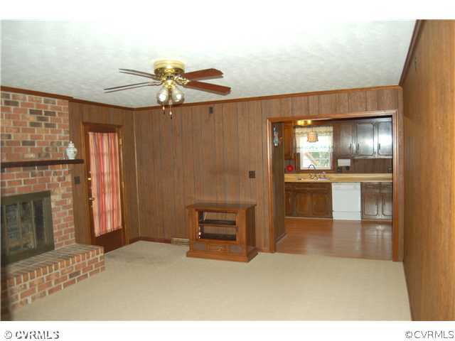 17401 Elko Road Petersburg, VA 23803 - Photo 11 of 12 a kitchen view with granite countertop cabinets and refrigerator
