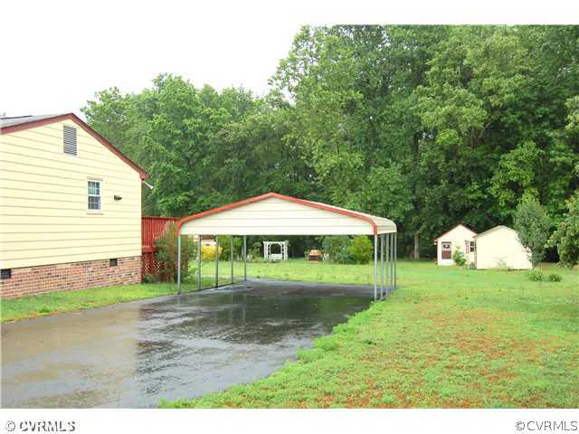 17401 Elko Road Petersburg, VA 23803 - Photo 12 of 12 a view of a house with a yard and sitting area