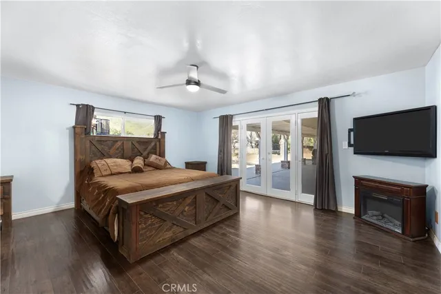 a view of a hallway view with wooden floor and furniture