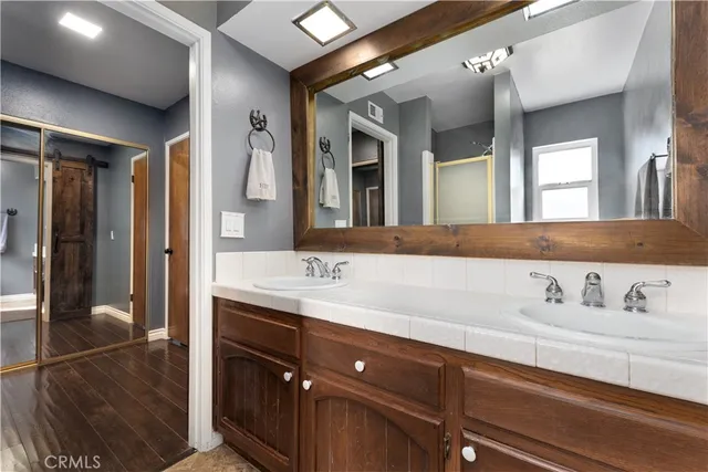 a bathroom with a bathtub a toilet and a shower