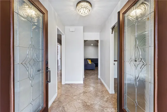 a kitchen with a refrigerator and a sink