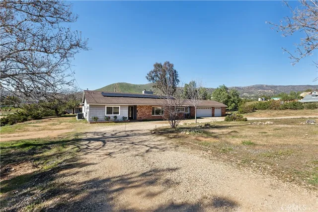 a view of a backyard of the house