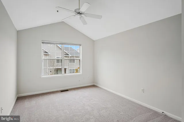 a view of an empty room and a window