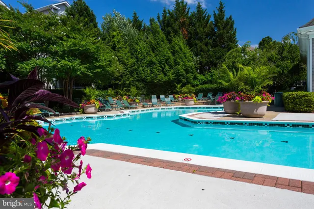 a view of a backyard with sitting area