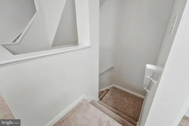 a living room with furniture and windows