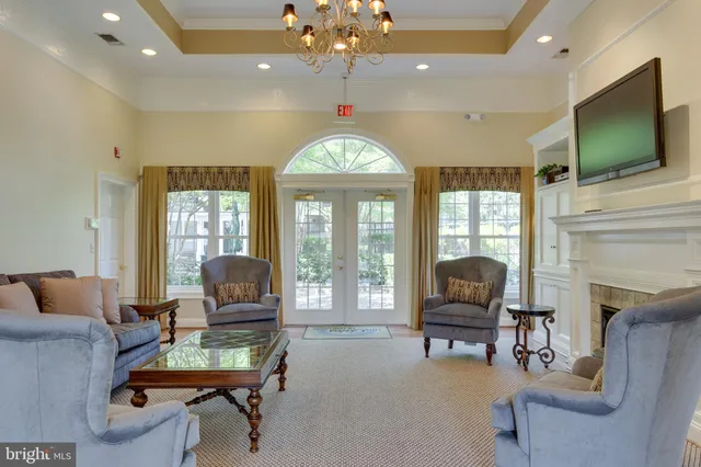 a backyard of a house with barbeque oven table and chairs