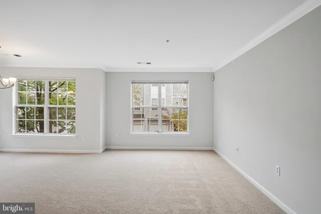 a view of a kitchen with refrigerator and microwave