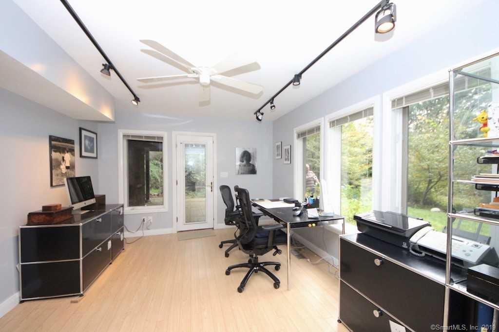 3 Little Brook Road Rowayton, CT 06853 - Photo 11 of 17 a view of a workspace with furniture and a window