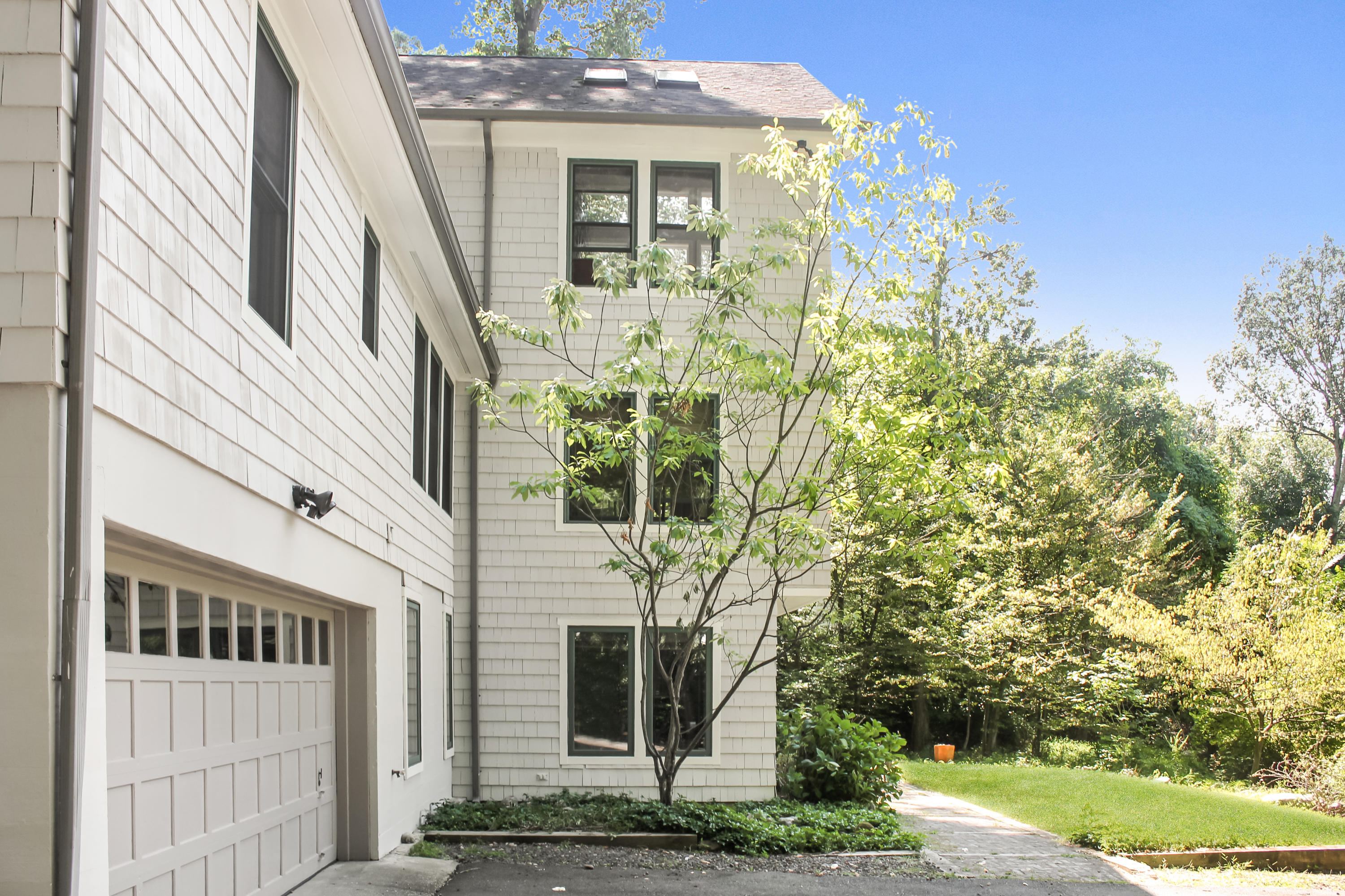 3 Little Brook Road Rowayton, CT 06853 - Photo 14 of 17 a front view of a house with garden
