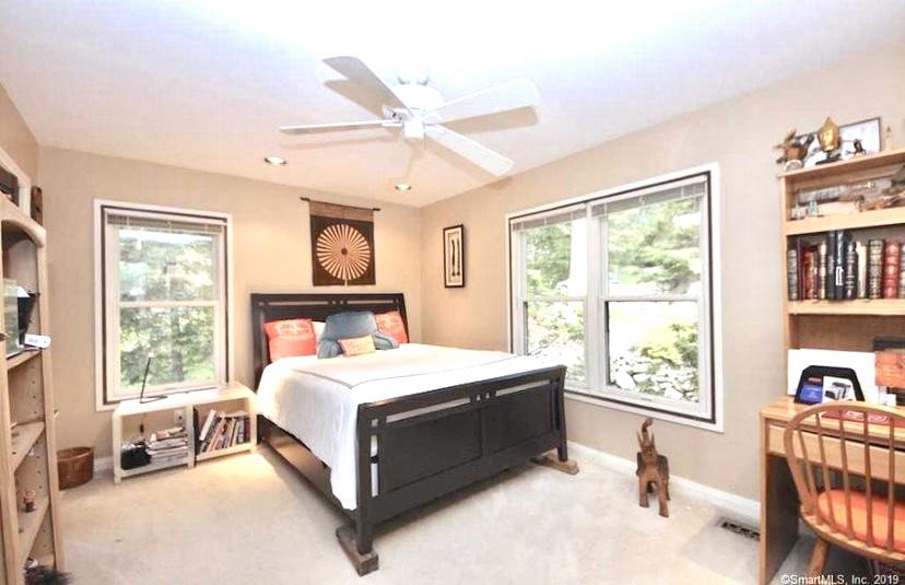 3 Little Brook Road Rowayton, CT 06853 - Photo 9 of 17 a bedroom with a bed and a window