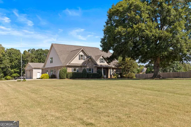 a front view of a house with a yard