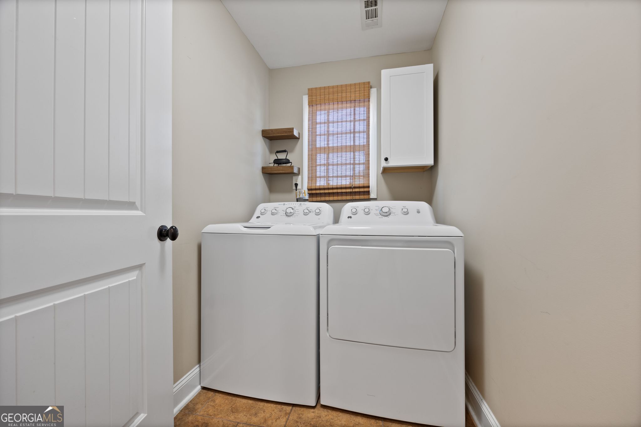 107 Sweet Bay Circle Milner, GA 30257 - Photo 15 of 31 a utility room with dryer and washer