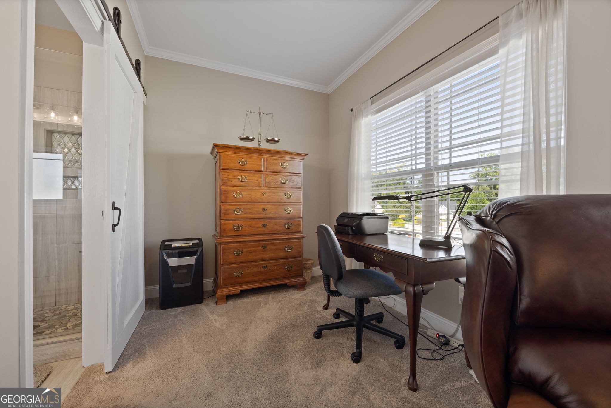 107 Sweet Bay Circle Milner, GA 30257 - Photo 18 of 31 a view of a workspace with furniture and a window
