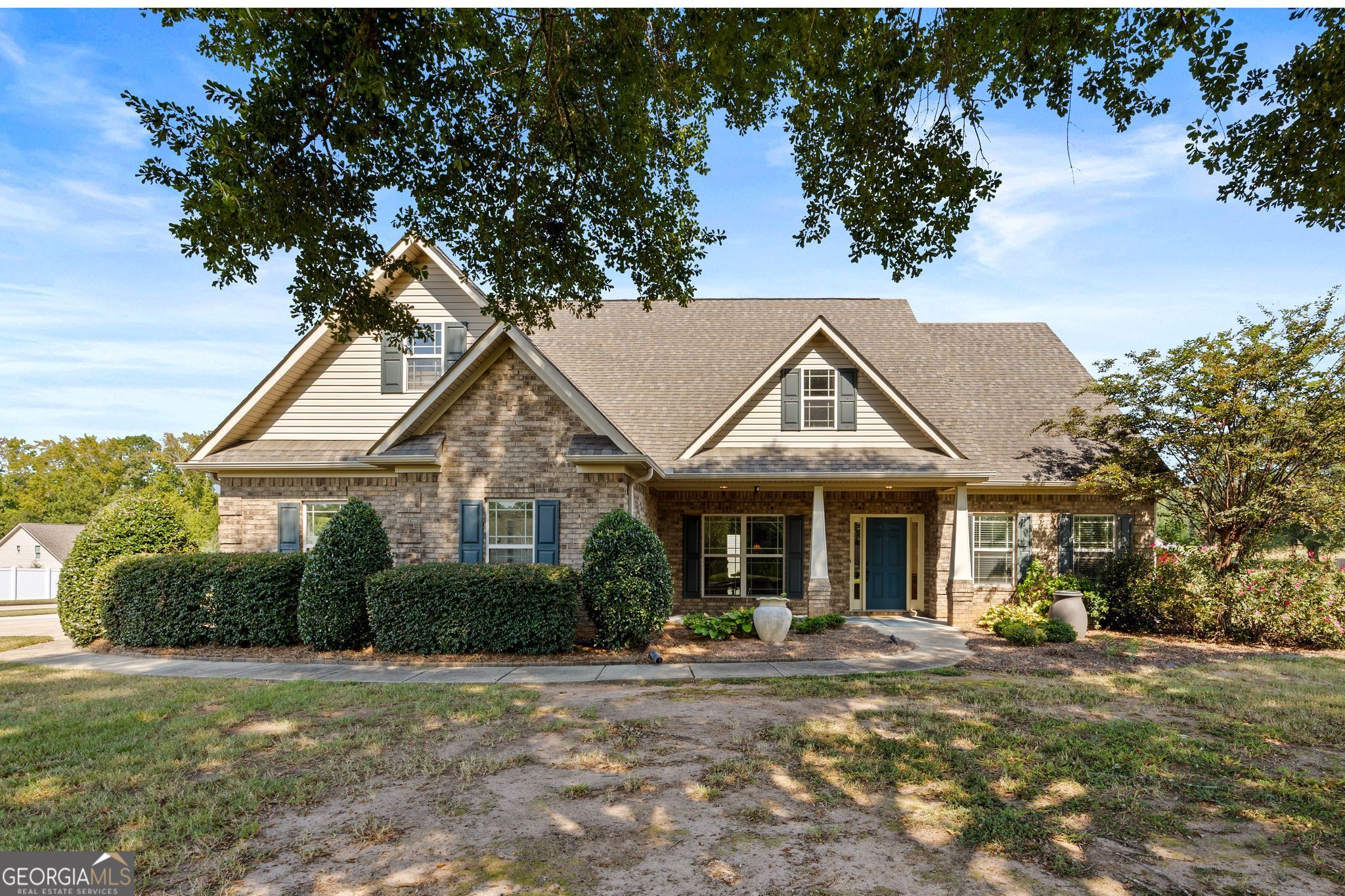 107 Sweet Bay Circle Milner, GA 30257 - Photo 2 of 31 a front view of a house with yard and green space